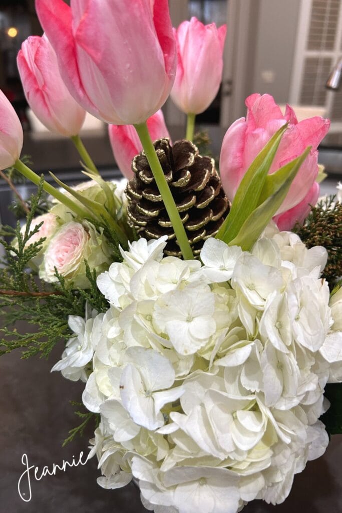 creamy white hydrangea, pink tulips, and cabbage roses