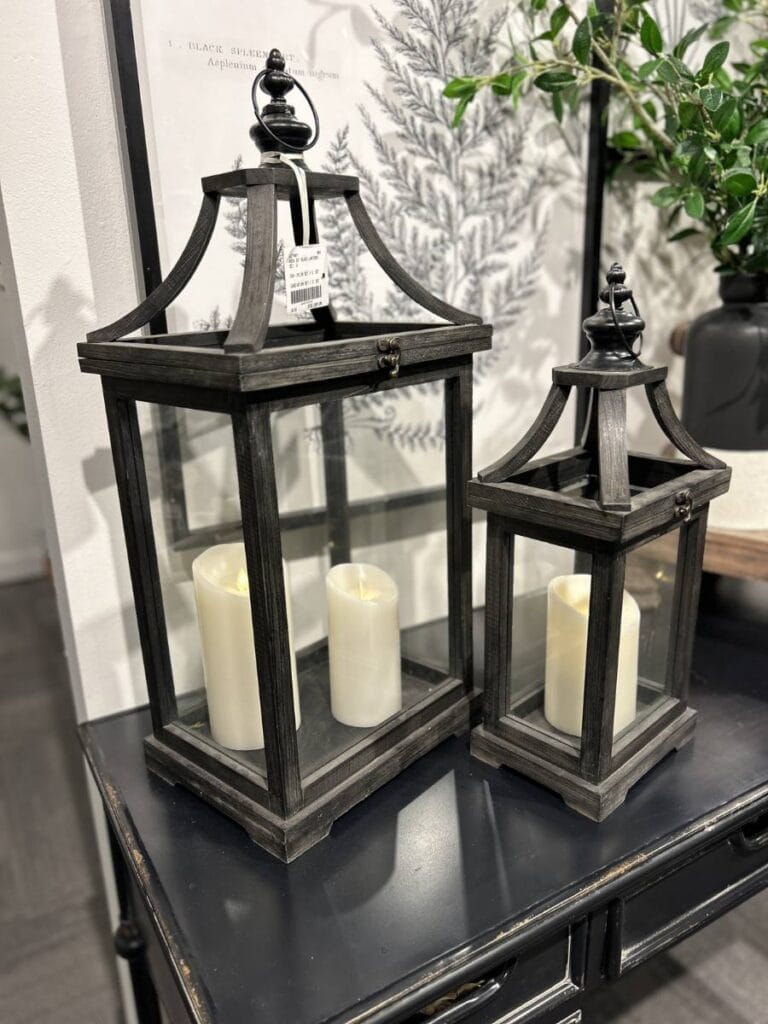 black metal lanterns with white battery candles