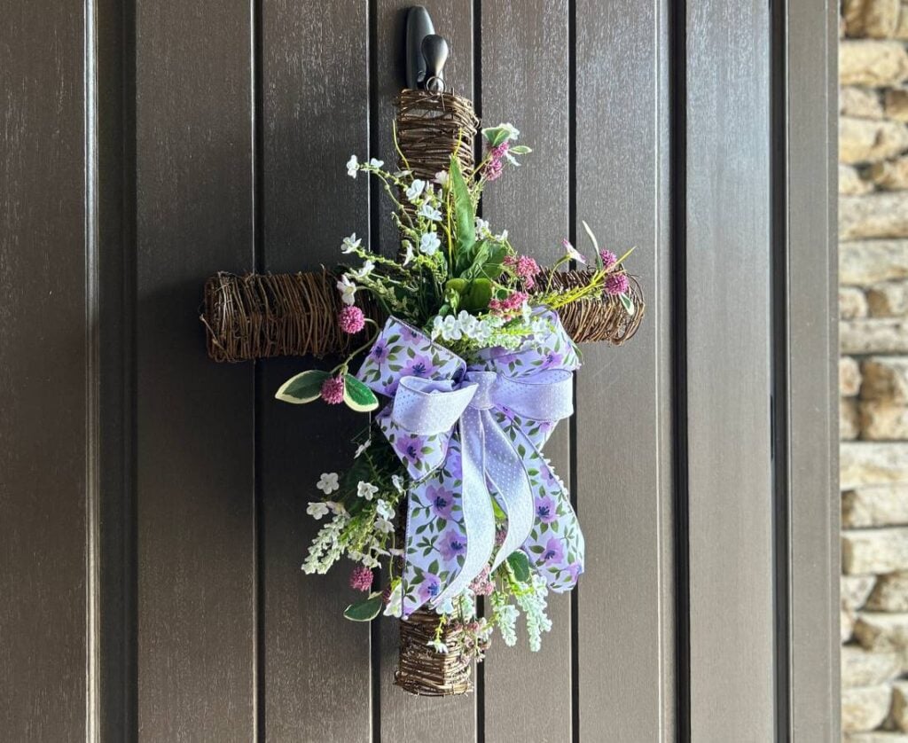 grapevine cross with flowers and a purple bow