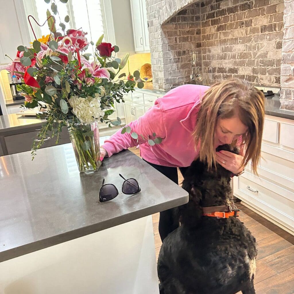 carrie giving browser a hug when delivering valentine flowers
