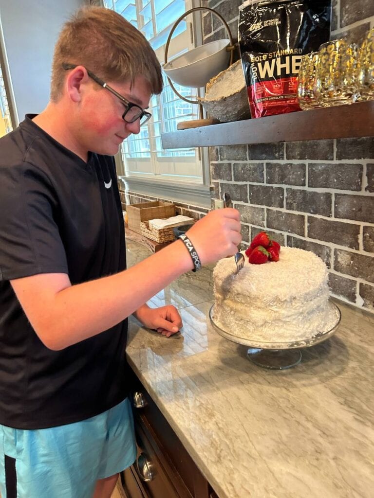 matt tasting his fresh coconut cake made for his birthday