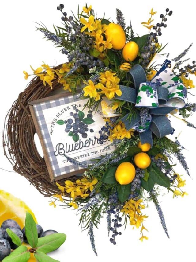 grapevine wreath decorated with lemons, blueberries, forsythia, blue astilbe and a pretty bow
