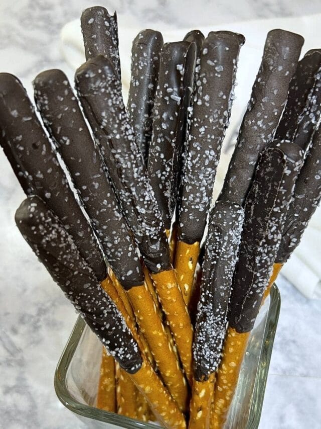 pretzel rods dipped with dark chocolate with sea salt sprinkles