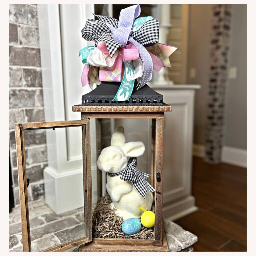 flocked bunny in a lantern with funky bow on top made from six different ribbons