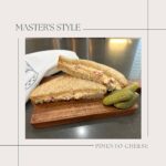 master's style homemade pimento cheeses sandwich spread on wheat bread with dill pickles