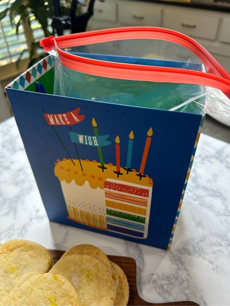 pack cookies in a zip lock bag in a birthday box from Dollar Tree