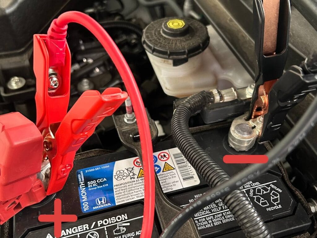 connect the positive clamp on the cable to the positive battery pole and negative to negative