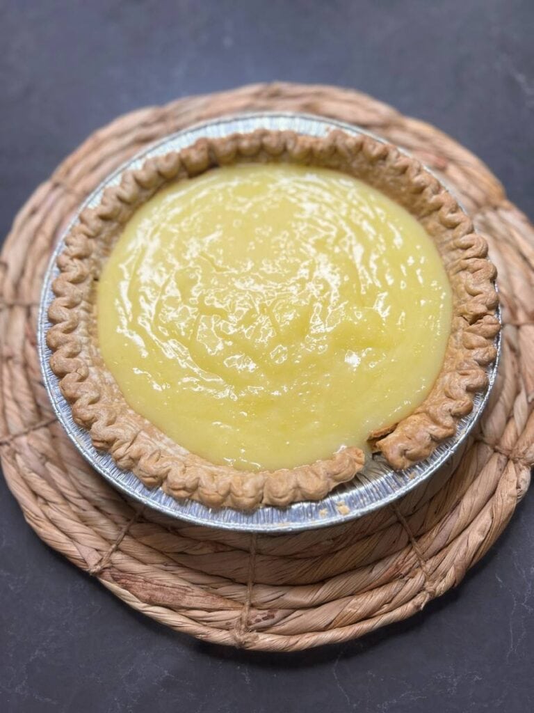 pour lemon pie filling into the baked pie shell