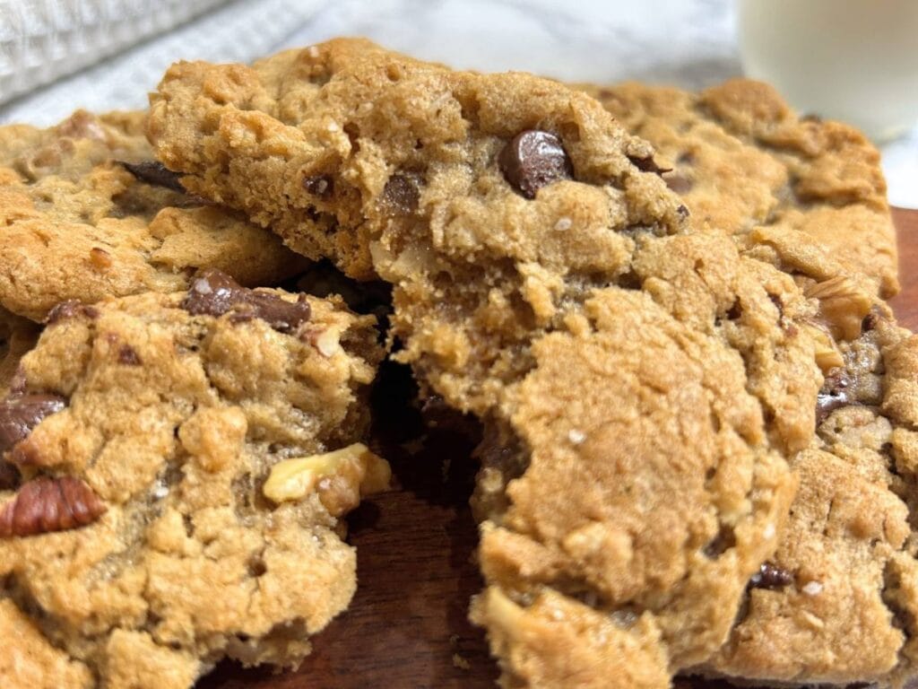 closeup of the chewy goodness of ranger cookies chocked full of nuts, chocolate chips, coconut, and rice krispies