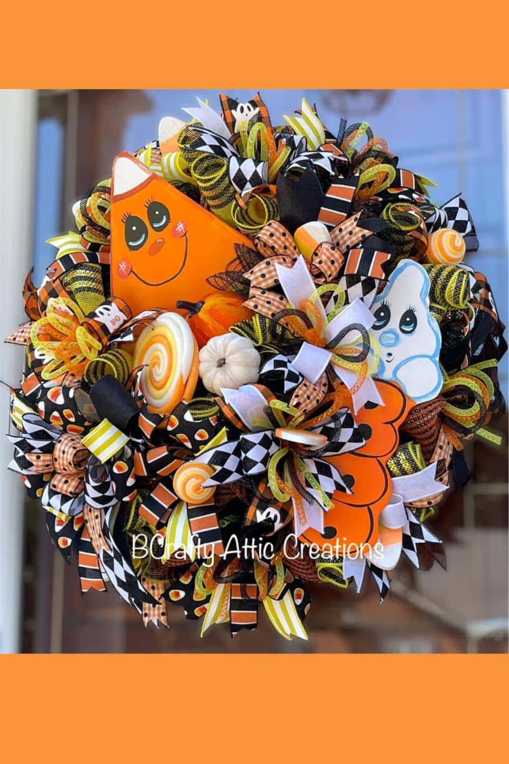 wreath with candy corn design, cute ghost, lots of ribbon and flex tubing