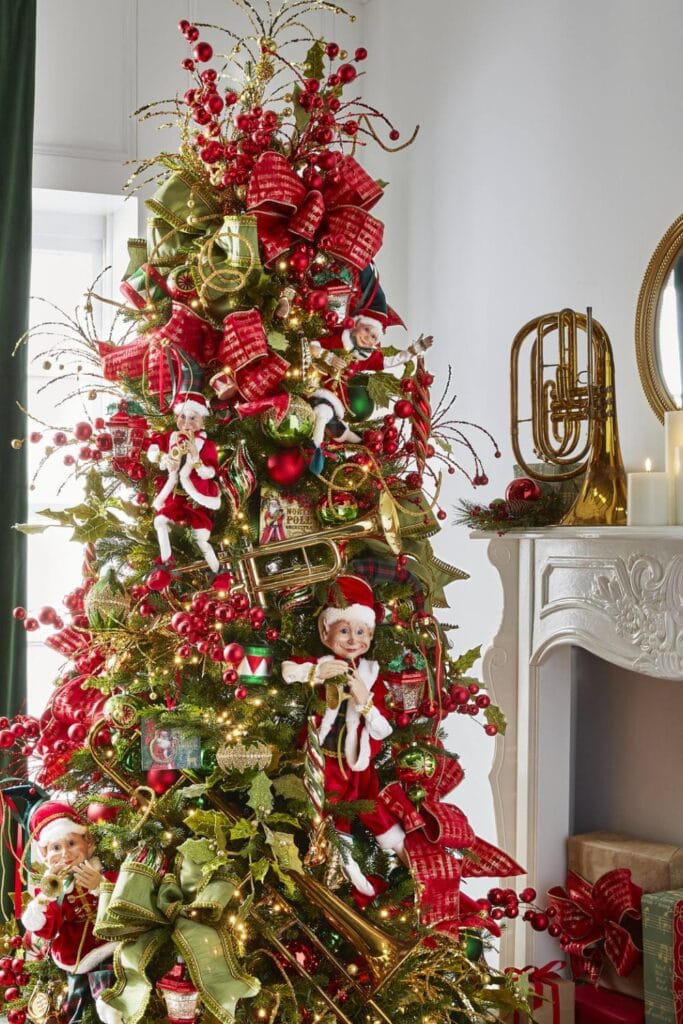 whimsical christmas tree decorated with mischievious elves, large musical instrument decorations, green velvet ribbons red ball picks and sprays, glittery curly sprays