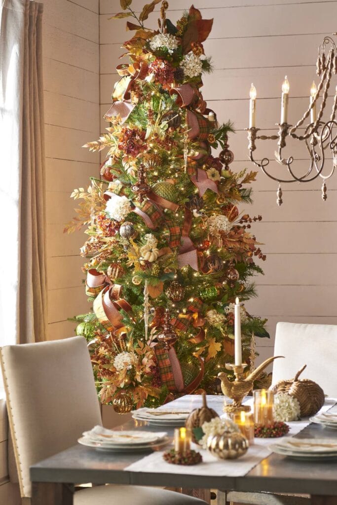 fall christmas tree decorated with amber florals, cream flowers, maple leaves, green balls, hydrangeas