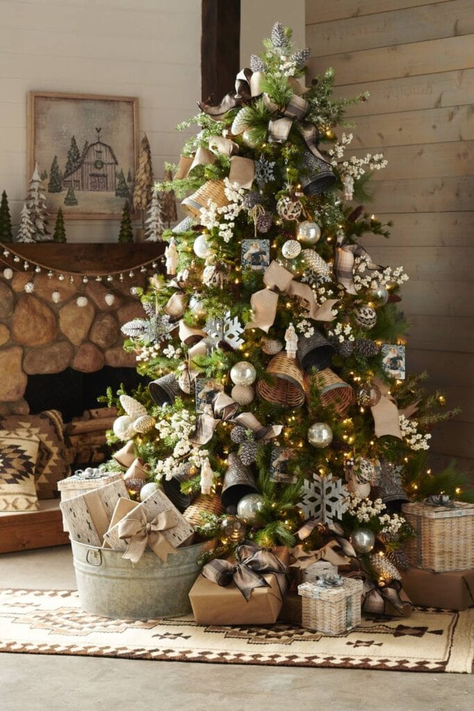 christmas tree with frosted pinecones, large bells, snowflakes, cream picks and sprays and wicker bells