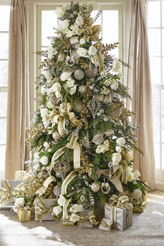 sage green christmas tree with champagne and cream colored ribbons, flowers, crystal ornaments