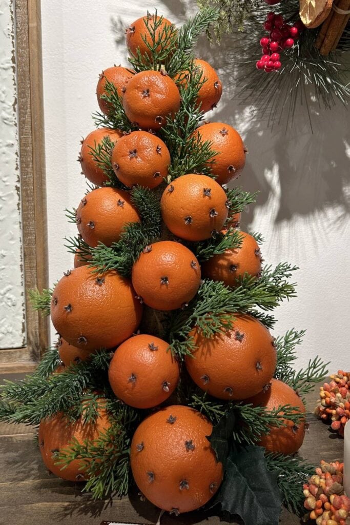 oranges studded with cloves for autumn decor for a kitchen or dining area