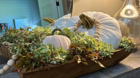 cream colored fabric pumpkin with real pumpkin stem
