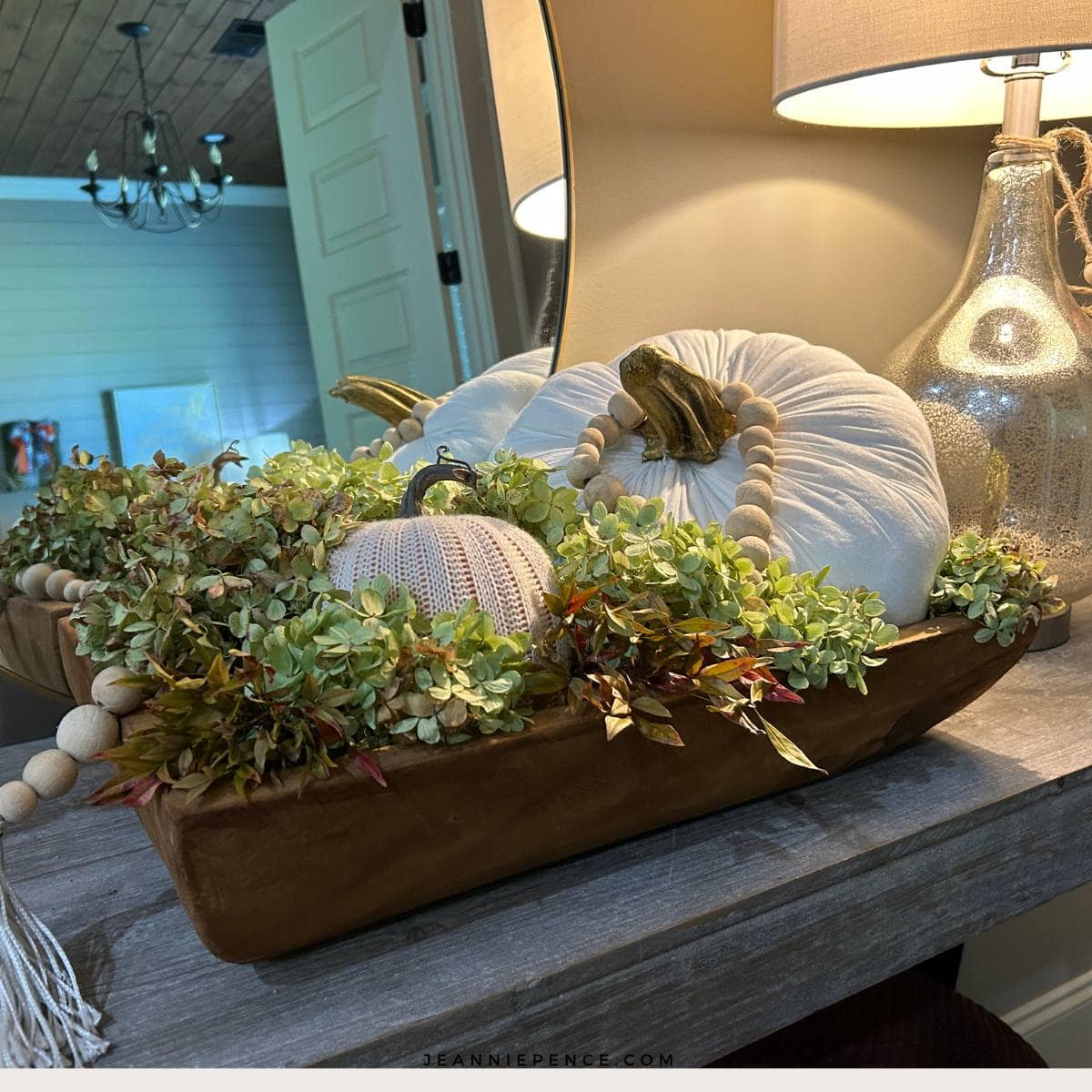 cream colored fabric pumpkin with real pumpkin stem
