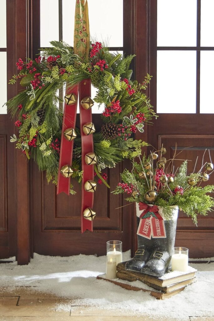 sleigh bells adorning an evergreen wreath