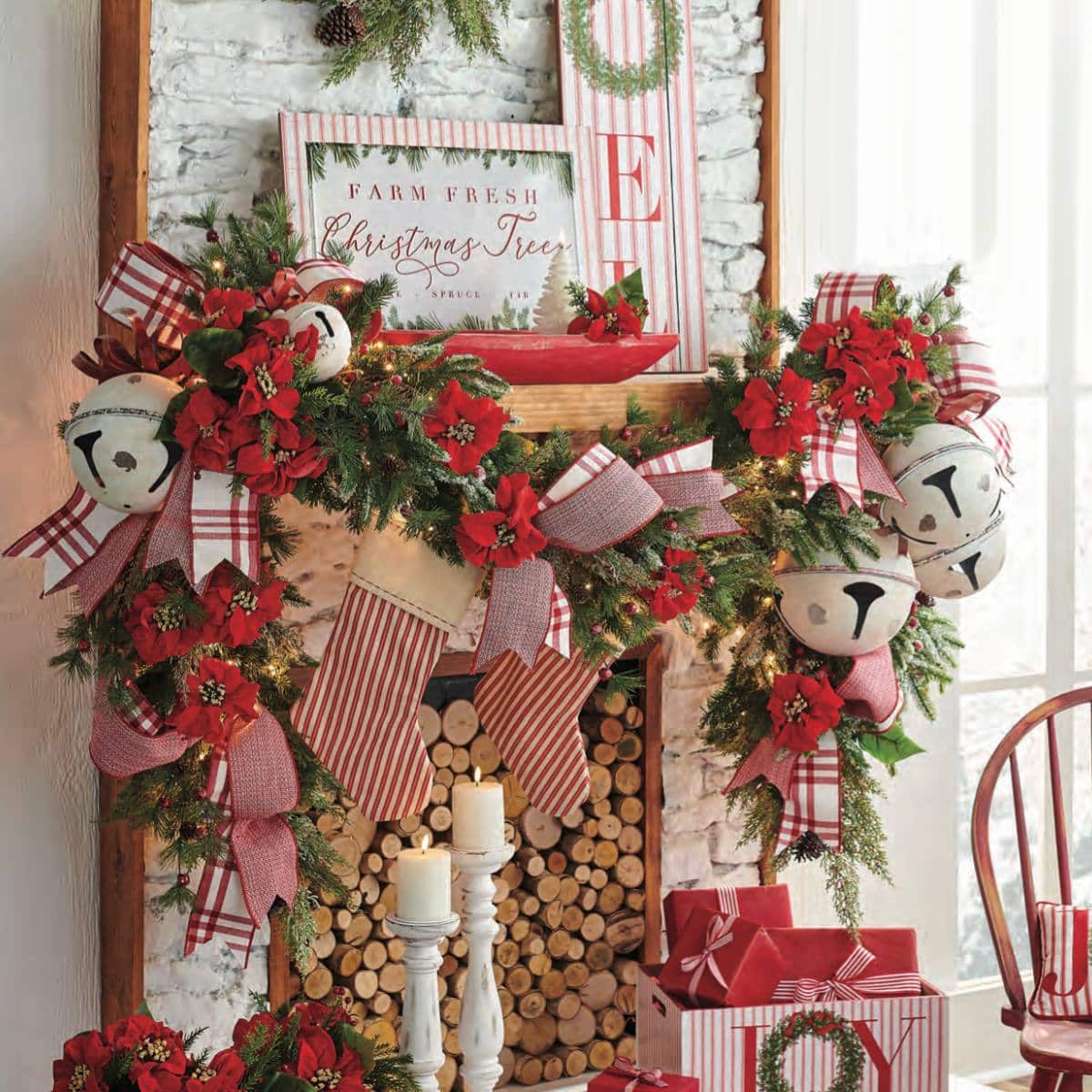 country style christmas decorations with red, ticking ornaments, red ribbon, poinsettias, cardinals