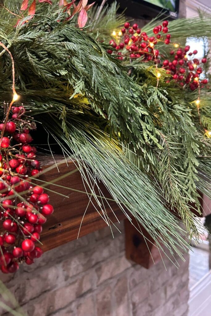 fresh cedar, faux pine garland for outdoor mantel