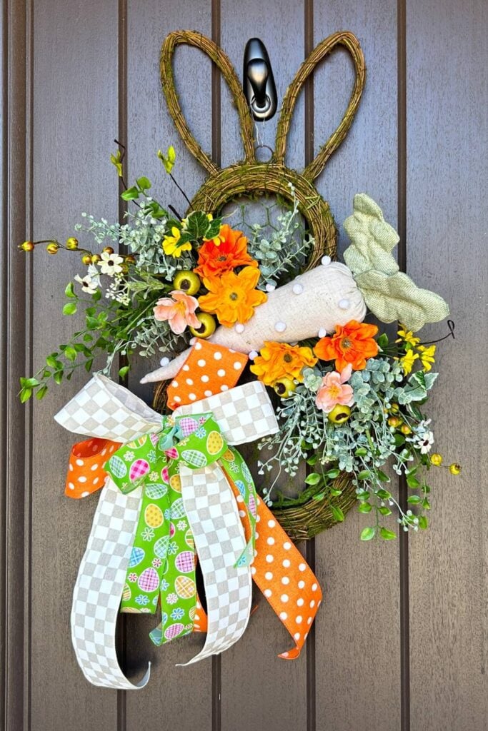 twig and moss bunny door hanger with flowers and spring ribbon