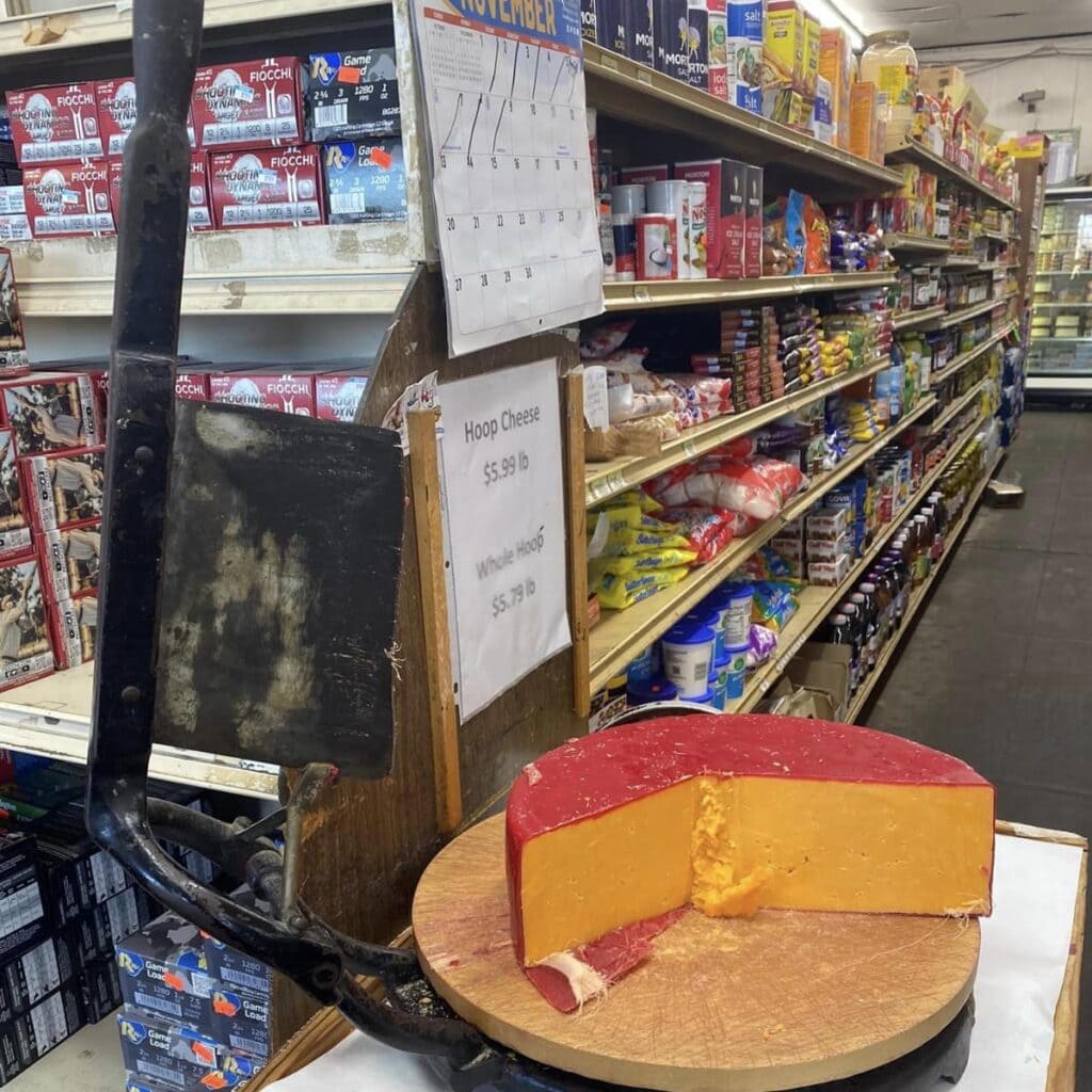a round of hoop cheese with cutter ar the williams brothers general store