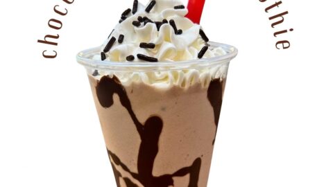 chocolate protein shake with whipped cream and sprinkles