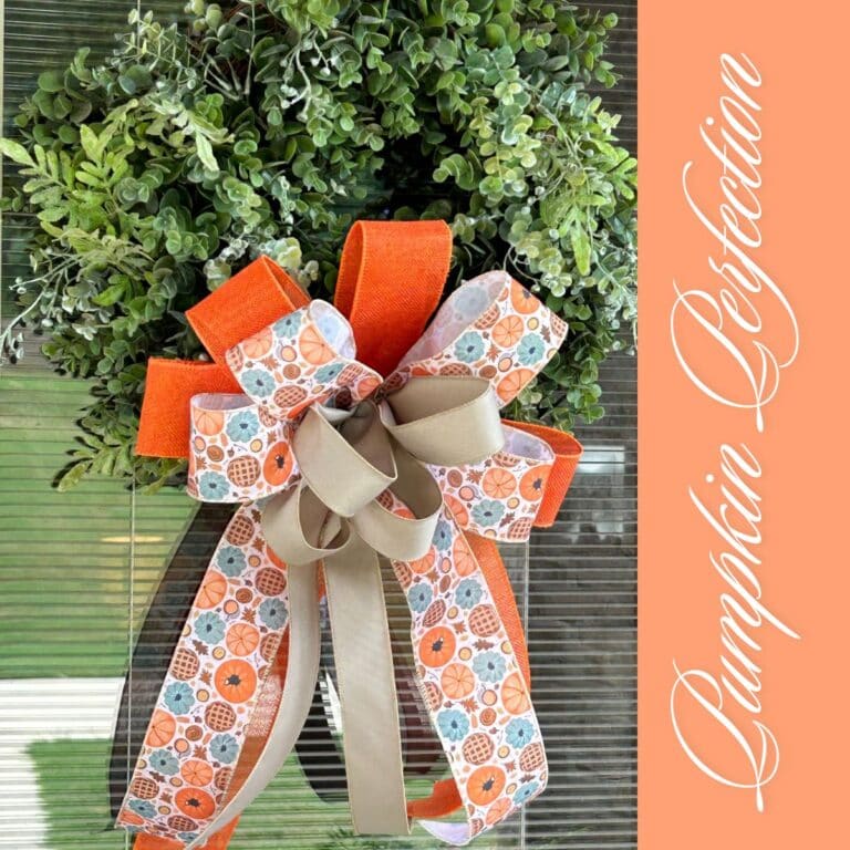 fall bow for a boxwood wreath in orange, pumpkin print and taupe ribbons