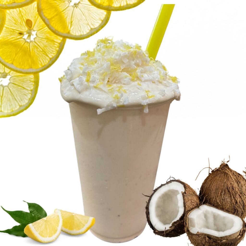 lemony coconut protein smoothie topping with whipped cream, coconut and lemon zest