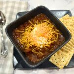 toucan chili, made with two of everything, served with crackers