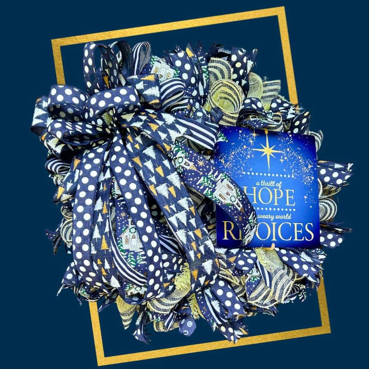blue silver and gold mesh wreath with thrill of hope sign