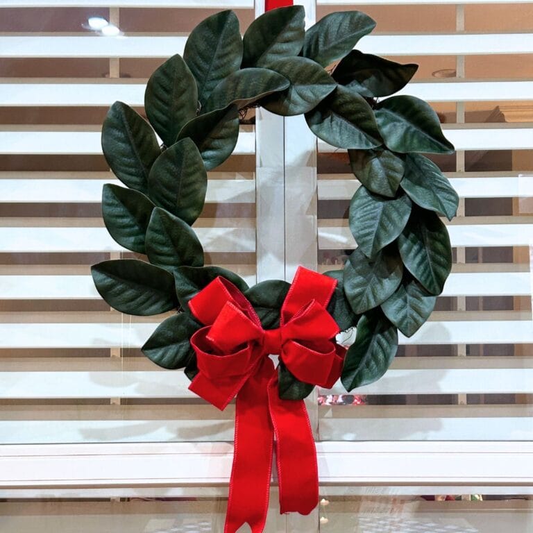 inexpensive Walmart magnolia wreath with red velvet bow