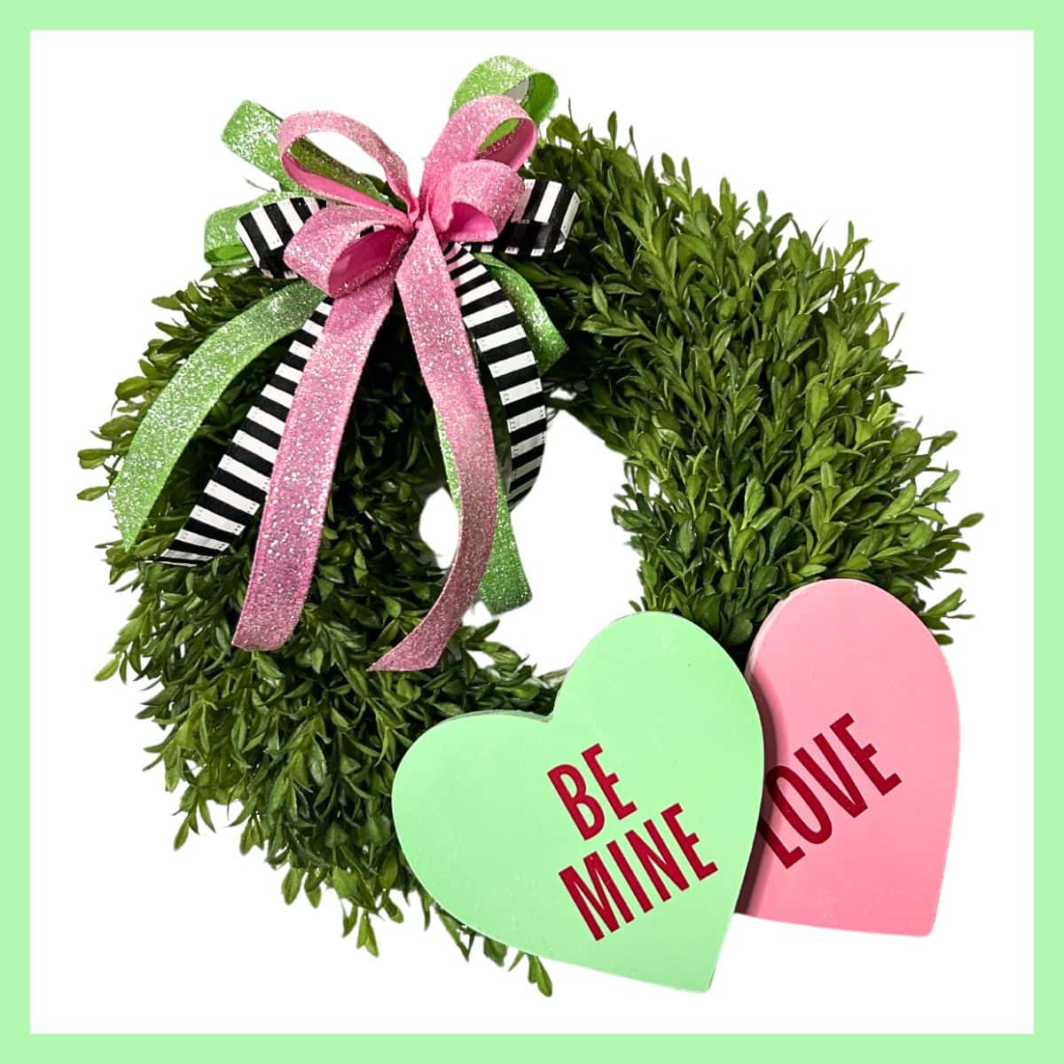 Valentine wreath DIY with hearts from the Dollar Tree and a glittery bow with ribbon from Trendy Tree