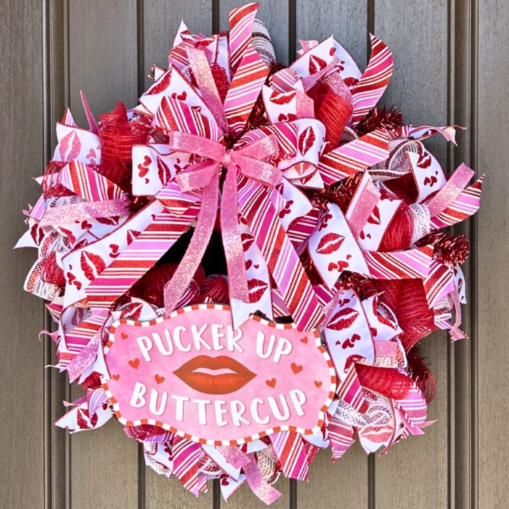 valentine wreath in traditional colors with pucker up buttercup sign