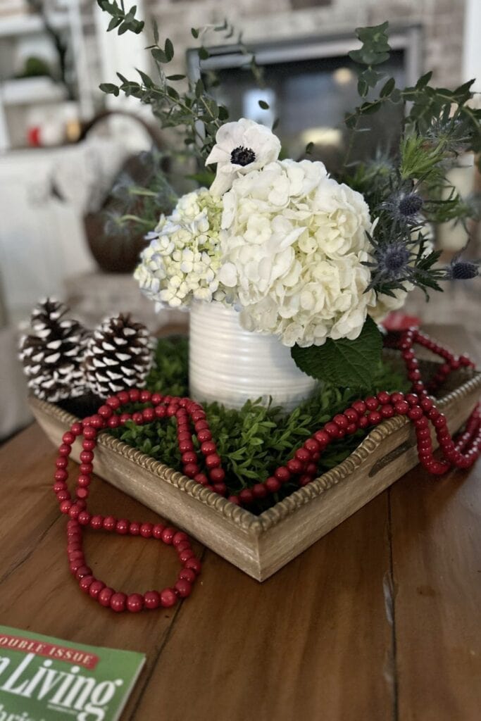 Christmas arrangement with red wood bead garland