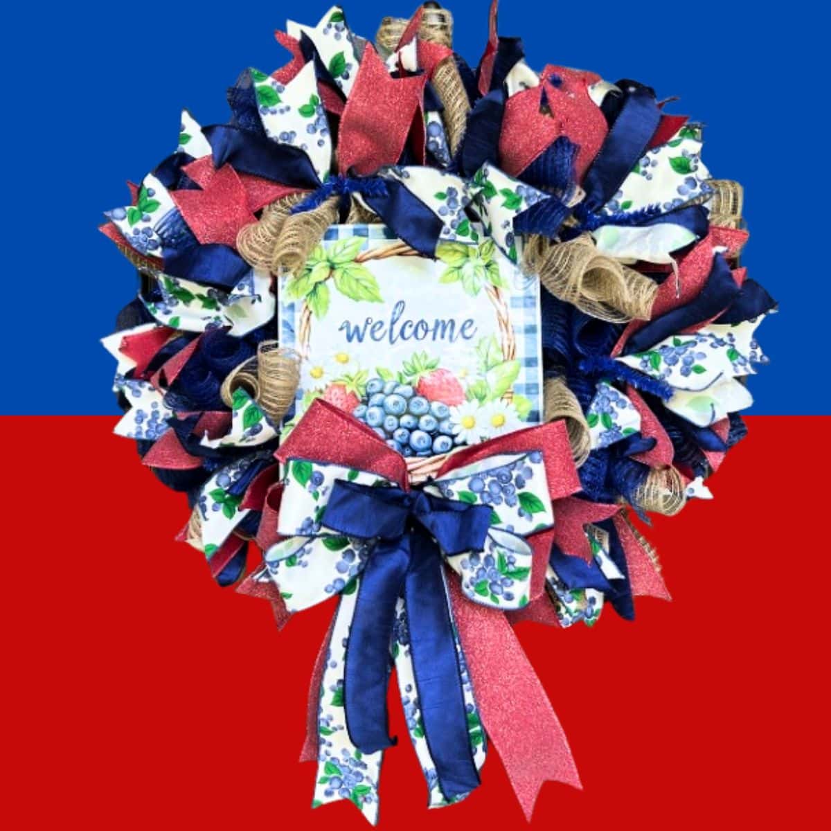 transitional patriotic wreath in red white and blue, perfect all summer with the welcome sign with blueberries and strawberries