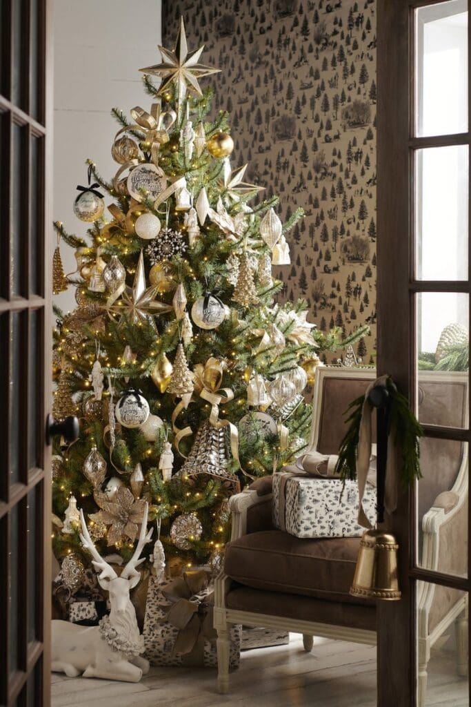 RAZ “Deck the Halls” Elegant Christmas Tree This tree is the picture of refined holiday style. With shimmering gold, champagne, and silver ornaments, metallic ribbons, and glittering stars, it creates a warm, glowing atmosphere.