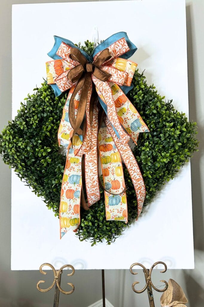 boxwood wreath with fall bow made with Em's Bowmaker