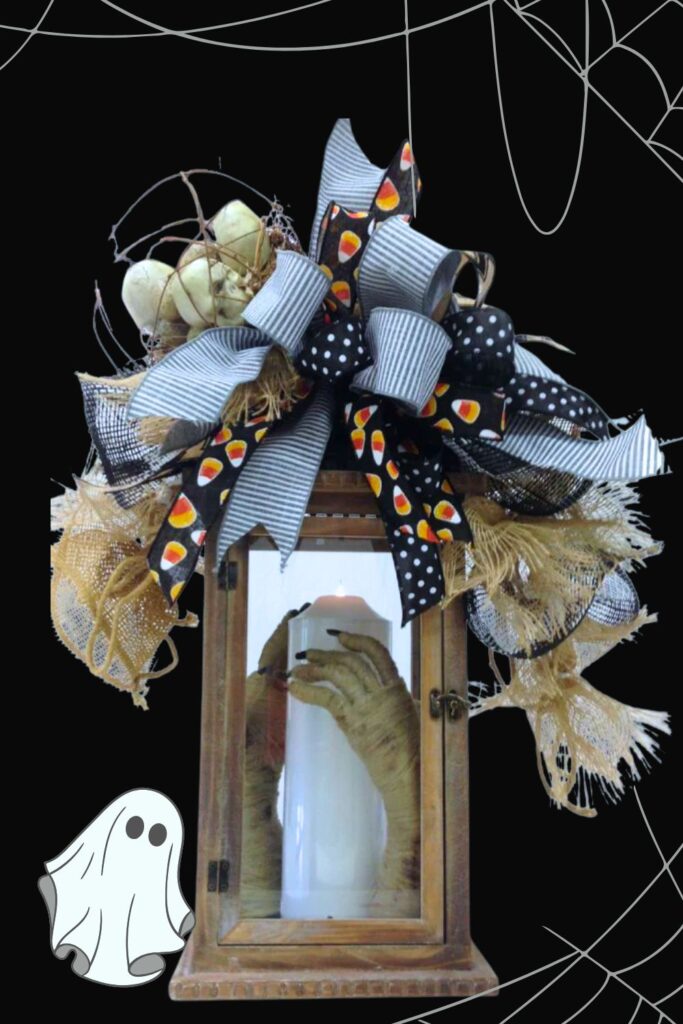 spooky halloween topper with mummy hands around a candle