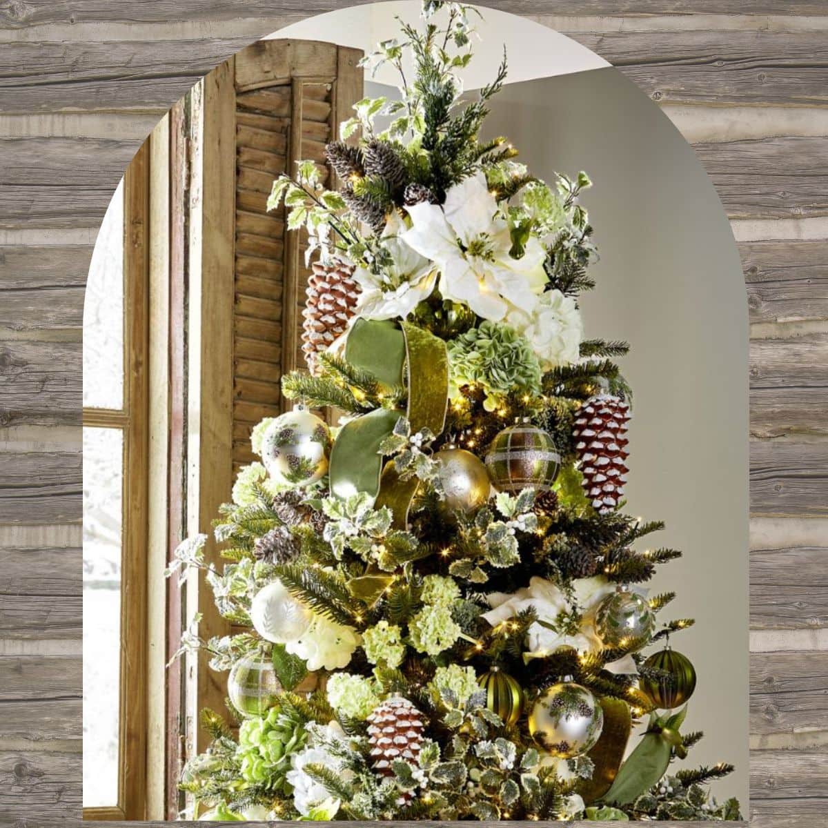 Rustic Christmas Tree Ideas - tree decorated with hydrangeas, frosted pinecones, snowy berries, shiny and matte balls, white poinsettias, iced greenery