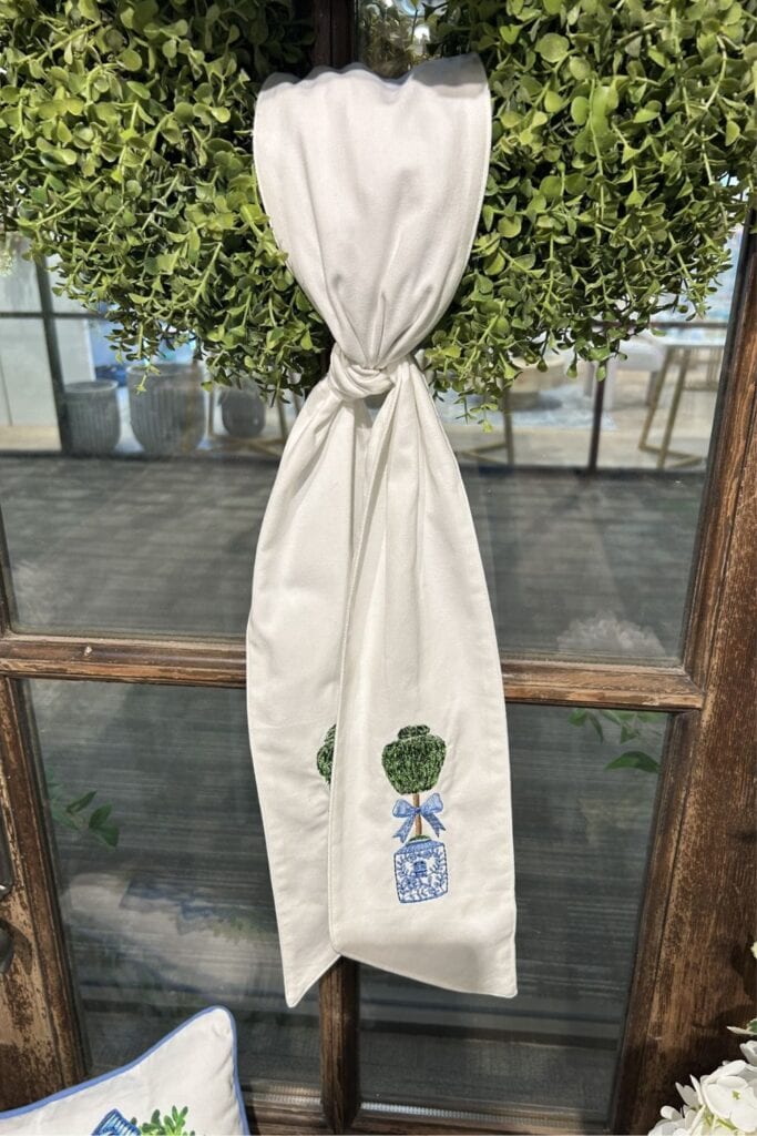 wreath sash on a boxwood wreath seen at the Dallas market