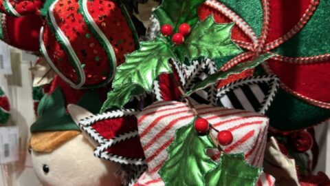ideas for Christmas tree whimsy using classic red, green, and white, with pops of black, whimsical elves, santas, package ornaments