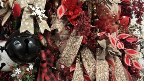 farmhouse christmas tree in the Craig Bachman Imports showroom, decorated by John Mark Enterprises