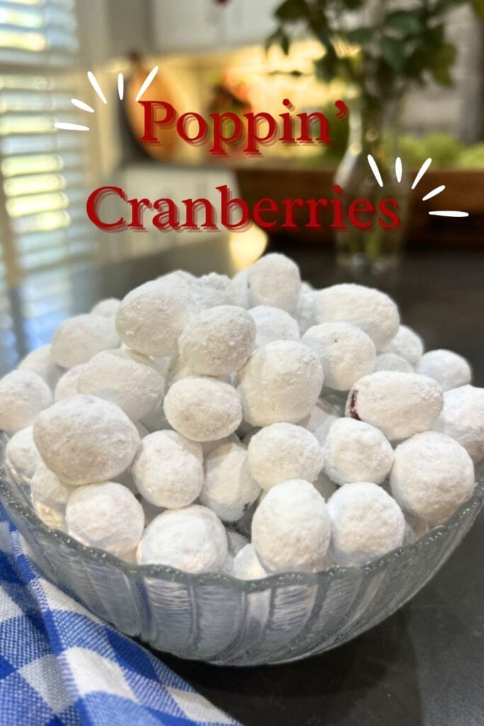 viral tiktok poppin' cranberries, fresh cranberries coated with powdered sugar and bake for a few minutes