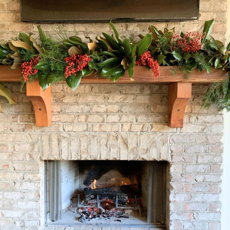 tutorial on how to make a fresh greenery garland for outdoor mantel using Magnolia, Cedar and Pine branches