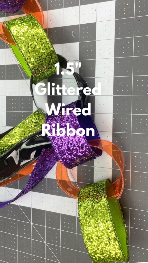 garland made with glittered purple, lime green ribbon and orang jelly ribbon