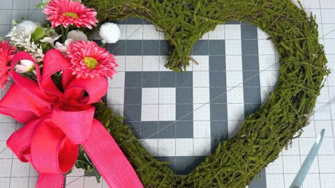 moss heart with simple gerber daisies and pink bow