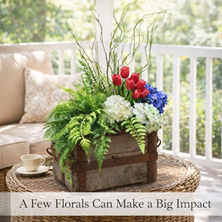 Decorating with faux florals in an old wooden crate showing how a few florals can make a big impact