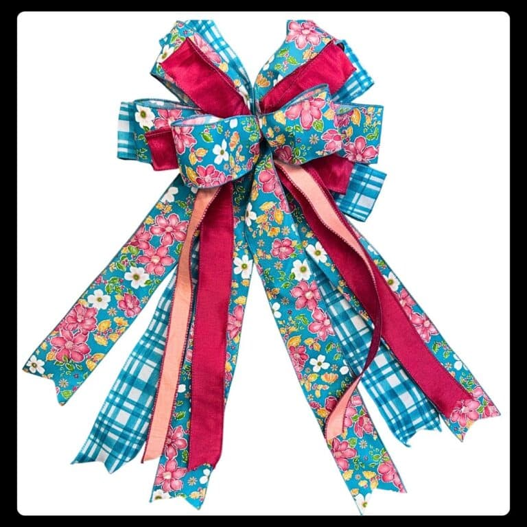 Wreath bow made with multiple sizes and styles of ribbon using the Em's Bow & Go foldable bowmaker from Trendy Tree.
